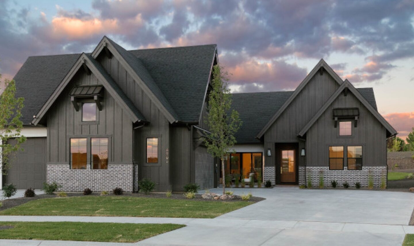 Modern home design with black roof and gray sidings by Xtreme Exteriors