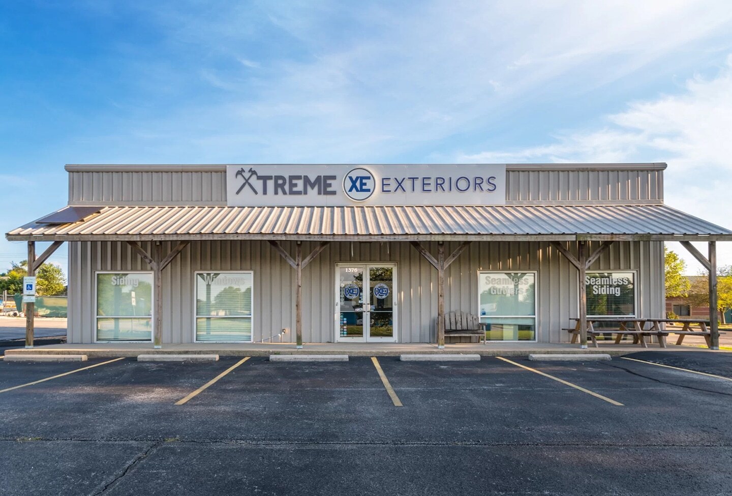 Exterior of the Xtreme Exteriors Shop building and and parking lot