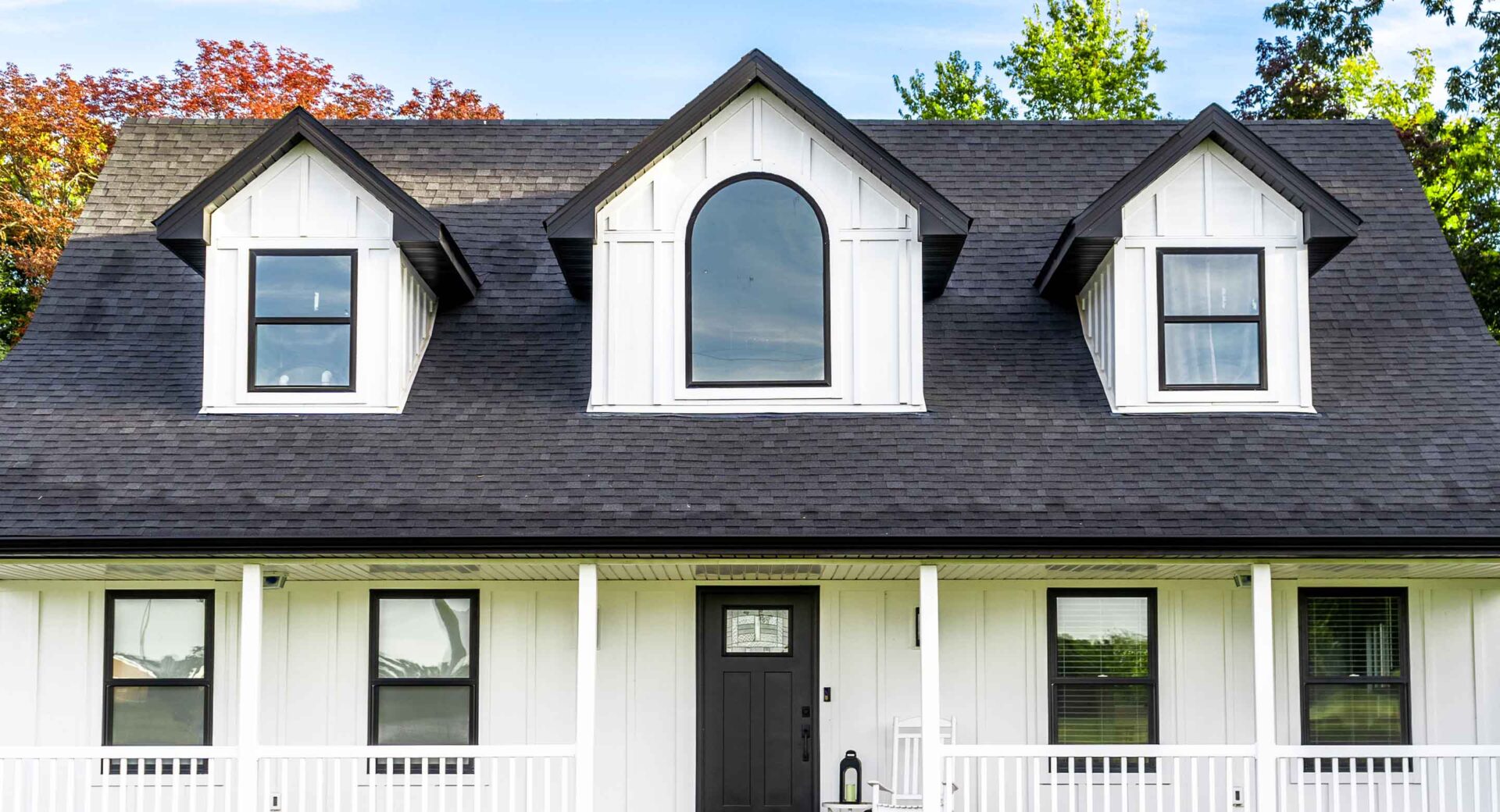 White home with dark shingles in the exterior visualizer example front view cropped