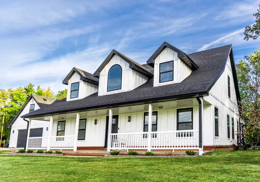 White home with dark shingles in the exterior visualizer example three quarter view right from low angle