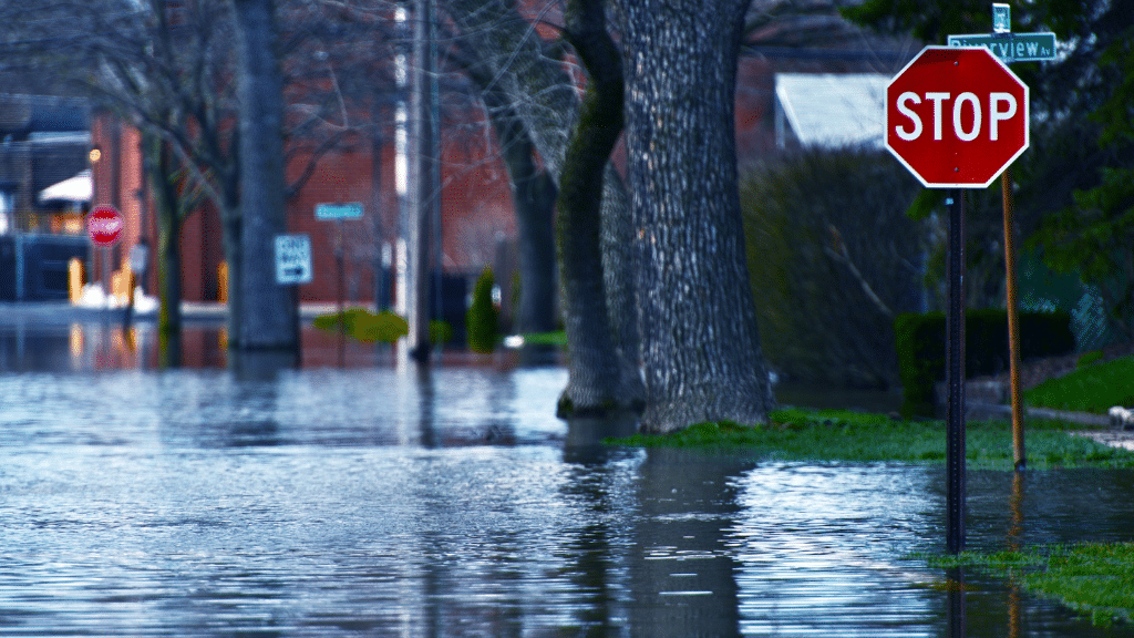 flooded street with stop sign Xtreme Exteriors in Kansas City, KS