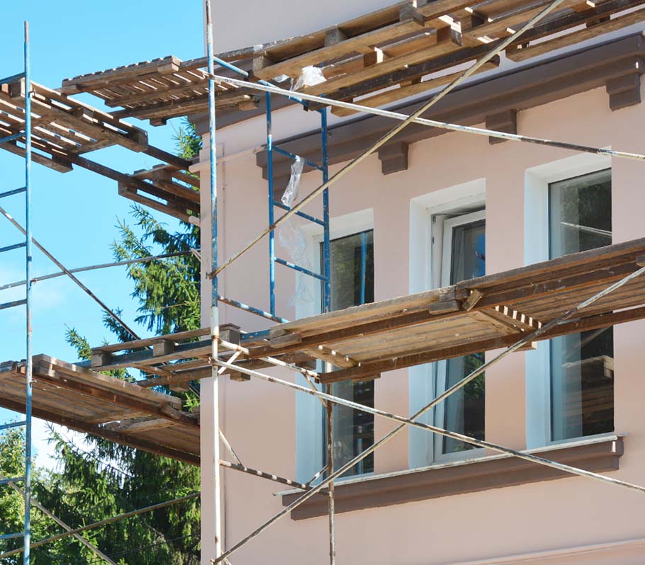 Scaffolding next to a building exterior for residential or commercial painting project