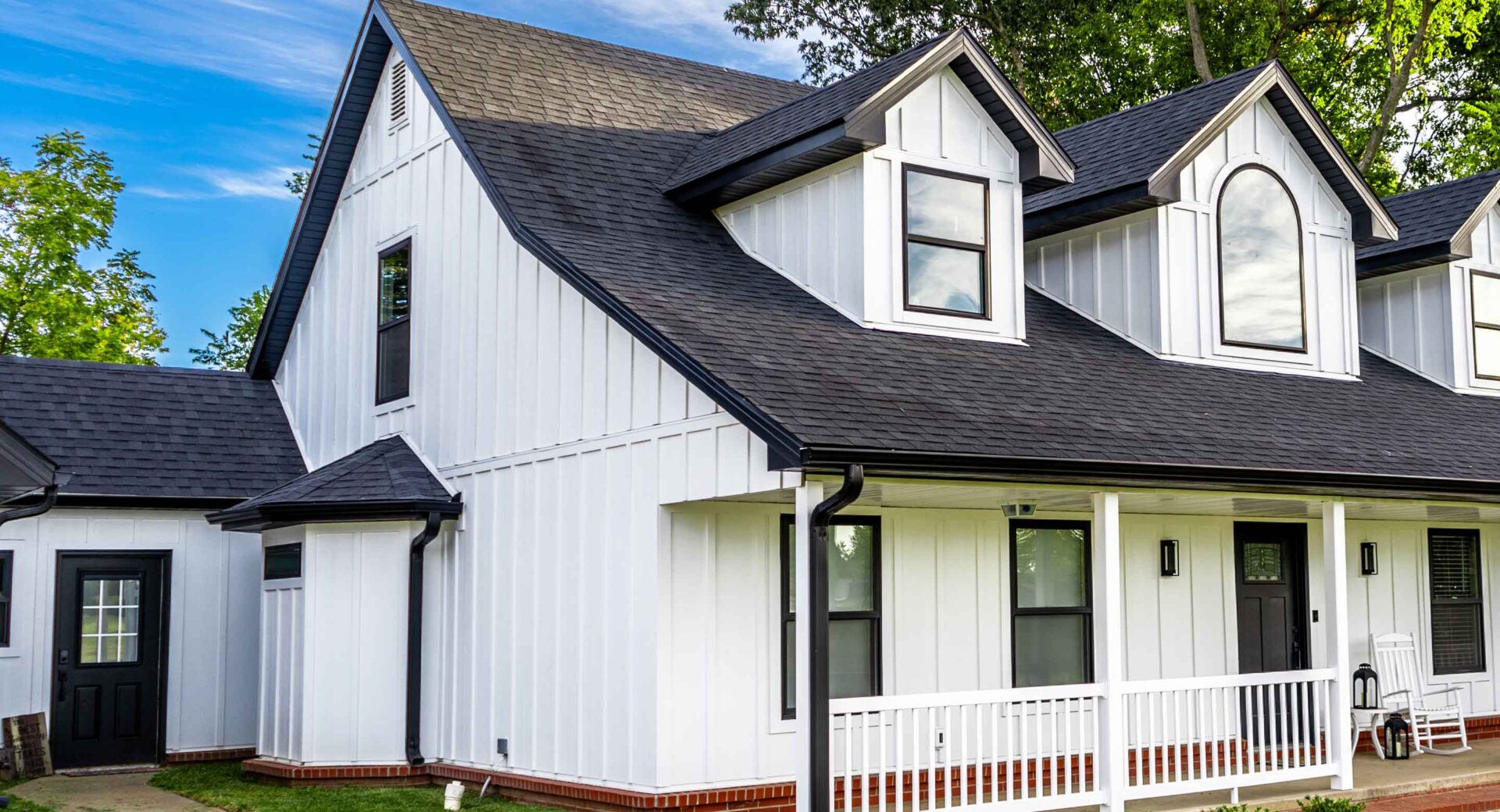 White home with dark shingles in the exterior visualizer example three quarter left view