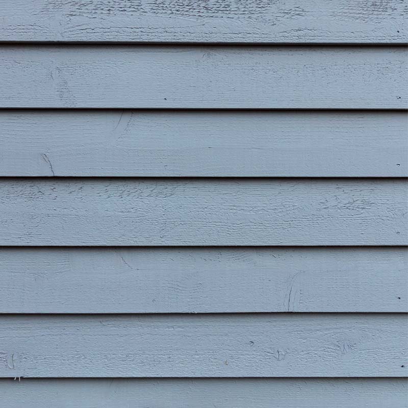 Exterior painting white on wood siding