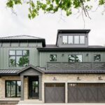 front view of a home showcasing a close up view of the magnolia collection shingle siding in green