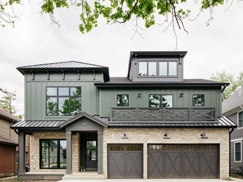 front view of a home showcasing a close up view of the magnolia collection shingle siding in green