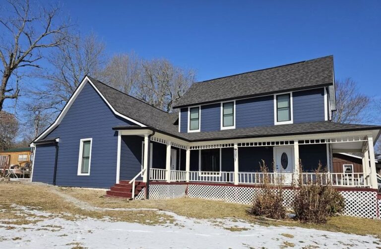 a historic Bakersfield home with blue James Hardie siding following a siding replacement