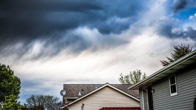 dark storm clouds above a home Xtreme Exteriors in Pittsburg, KS