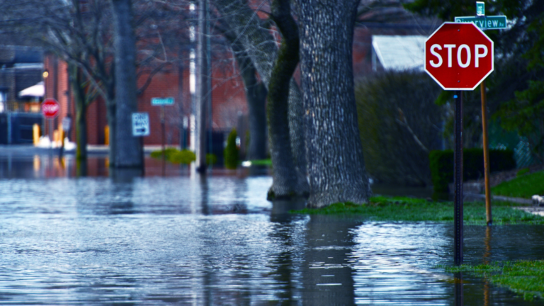 flooded street with stop sign Xtreme Exteriors in Kansas City, KS