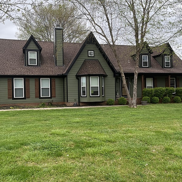 Brown roof with olive siding made by an exterior contractor in Shawnee