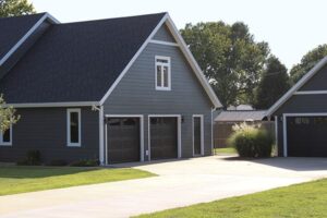 A modern gray house with a garage and a neatly paved driveway in Springfield.