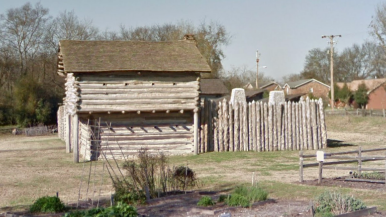 A historical house that has wooden roof and siding in Rogers