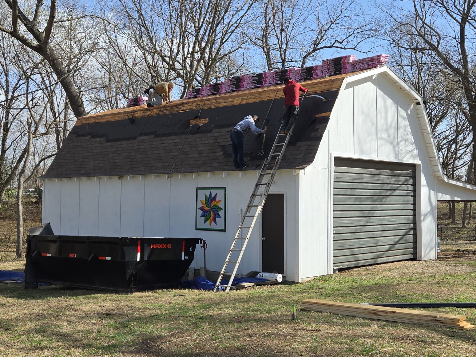 Roofing professionals installing a steep slope roof for enhanced durability and performance.