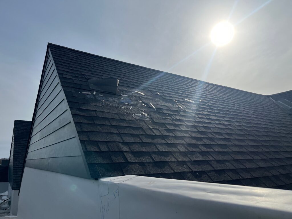 Roof showing hail damage compared to a roof with impact-resistant shingles.