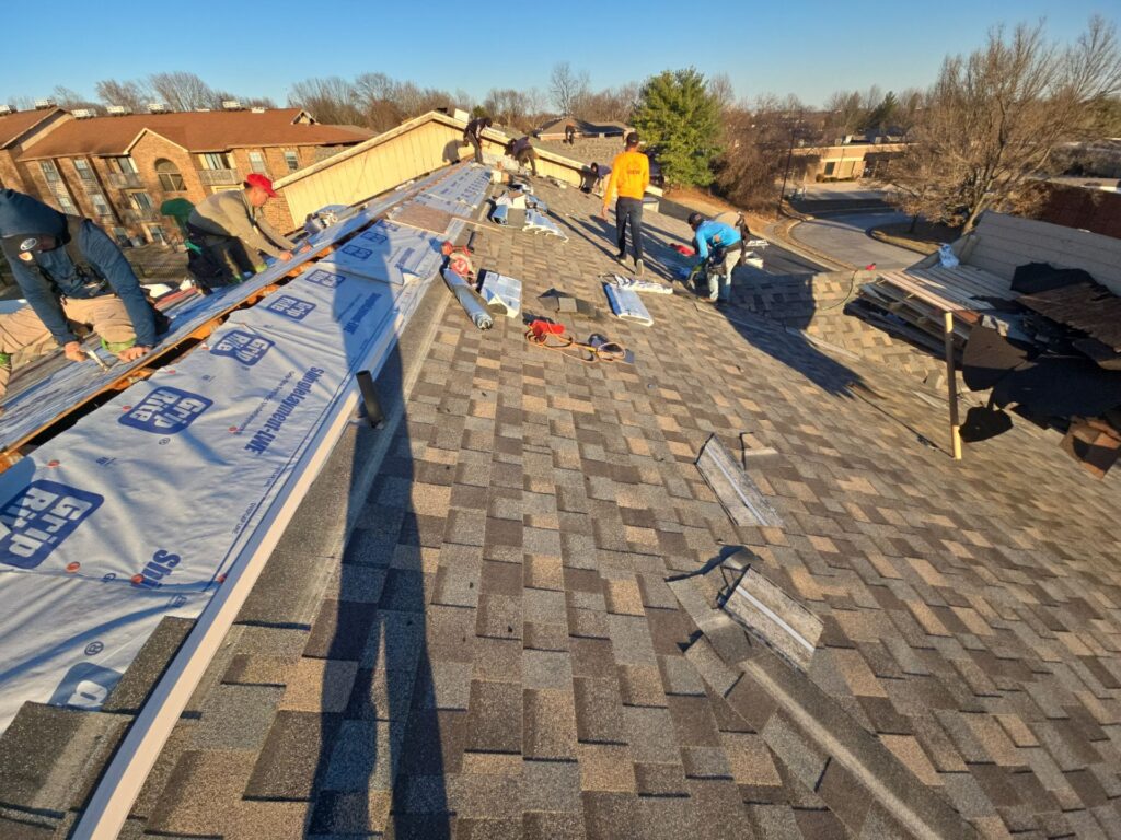 new roof with damaged shingles after installation of impact-resistant shingles.