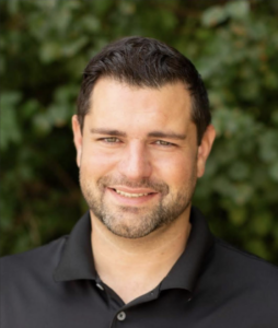 TJ Pippin smiling in an employee spotlight feature at Xtreme Exteriors