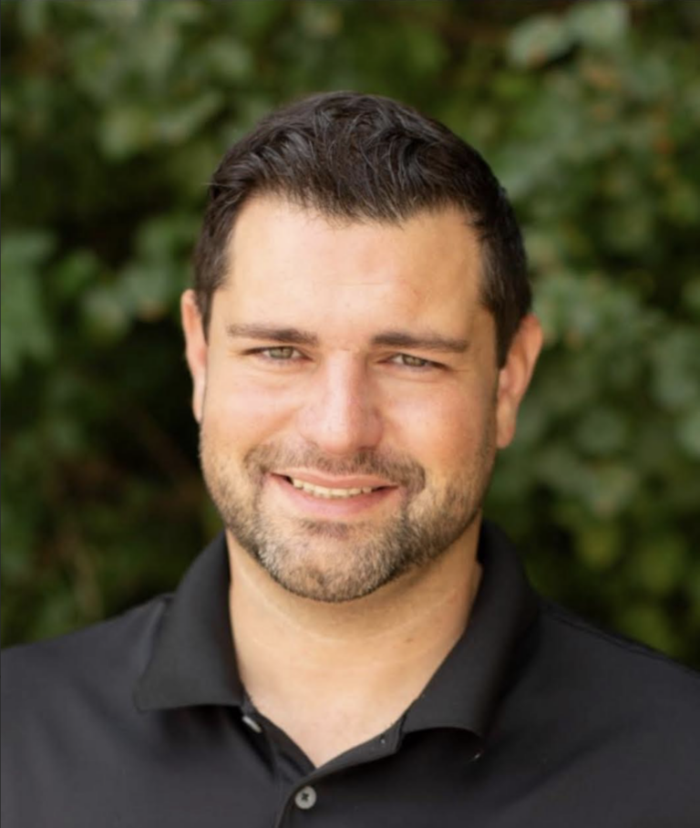 TJ Pippin smiling in an employee spotlight feature at Xtreme Exteriors