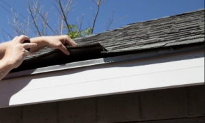 Damaged roof with missing shingles by Xtreme Exteriors | Xtreme Exteriors