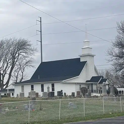 Traditional church with new dark roof, part of church roof replacement process by Xtreme Exteriors in Nixa, MO