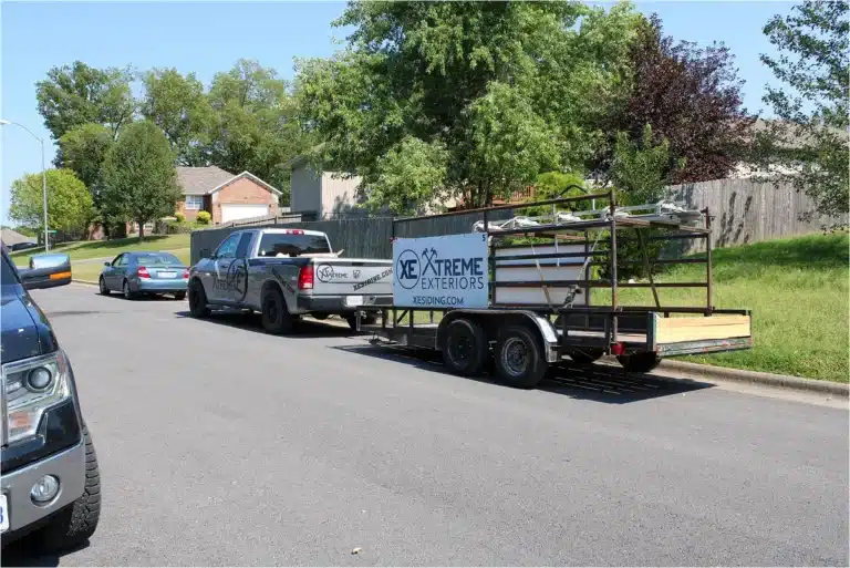 Xtreme Exteriors service truck and trailer ready for emergency siding repair Sikeston projects
