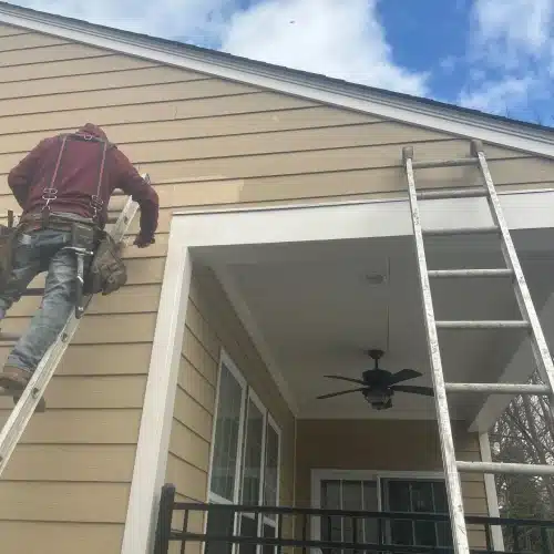 Repaired section on residential siding after emergency siding repair Springdale