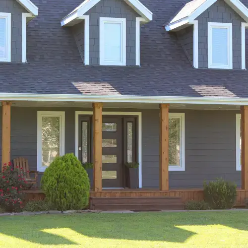 Modern residential exterior featuring mixed siding styles and colors by Xtreme Exteriors in Nixa, MO