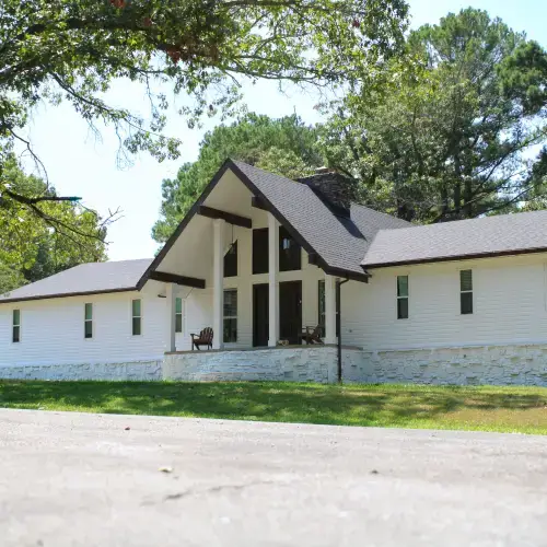 Modern white house with stylish siding design surrounded by trees in Goodlettsville, TN