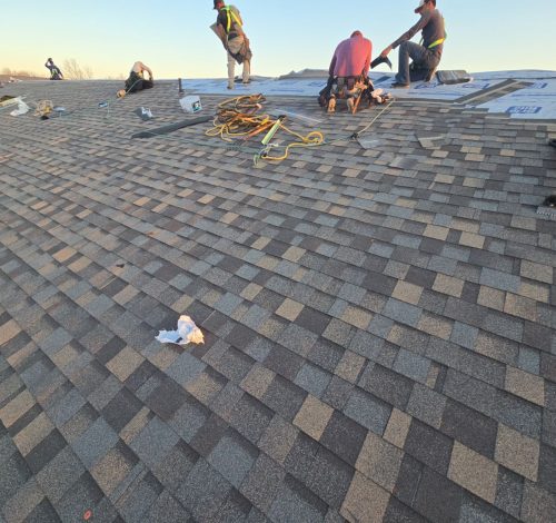 Xtreme Exteriors team installing a steep slope roof with proper safety measures.